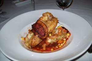 Bacon wrapped walleye with corn & tomato, sweet potato praline bread pudding and Carolina BBQ sauce 