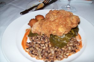 Buttermilk fried chicken with tomato & onion stewed collards, black eye peas, corn & hot pepper hushpuppies